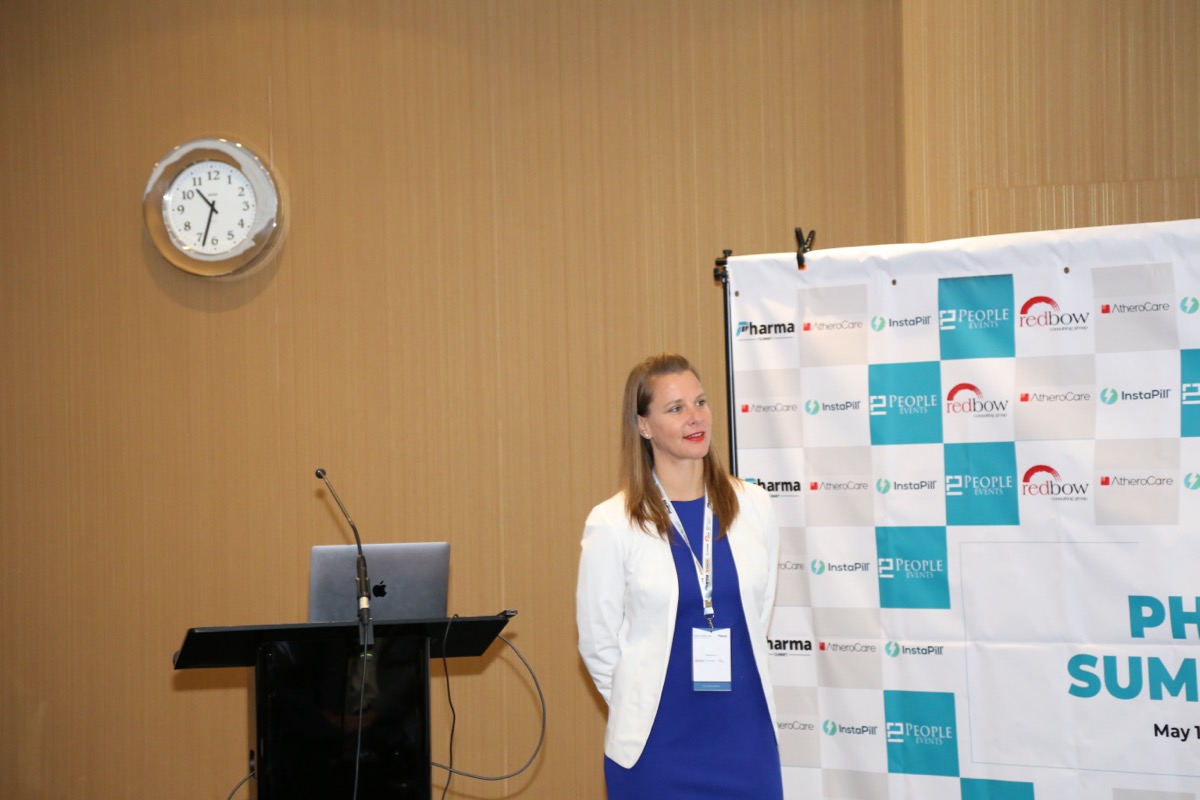 Selina Gaertner at the speaker podium, Global Pharma Tech Summit 2026